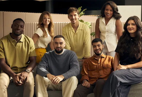 A group of L’Oréal employees smiling together
